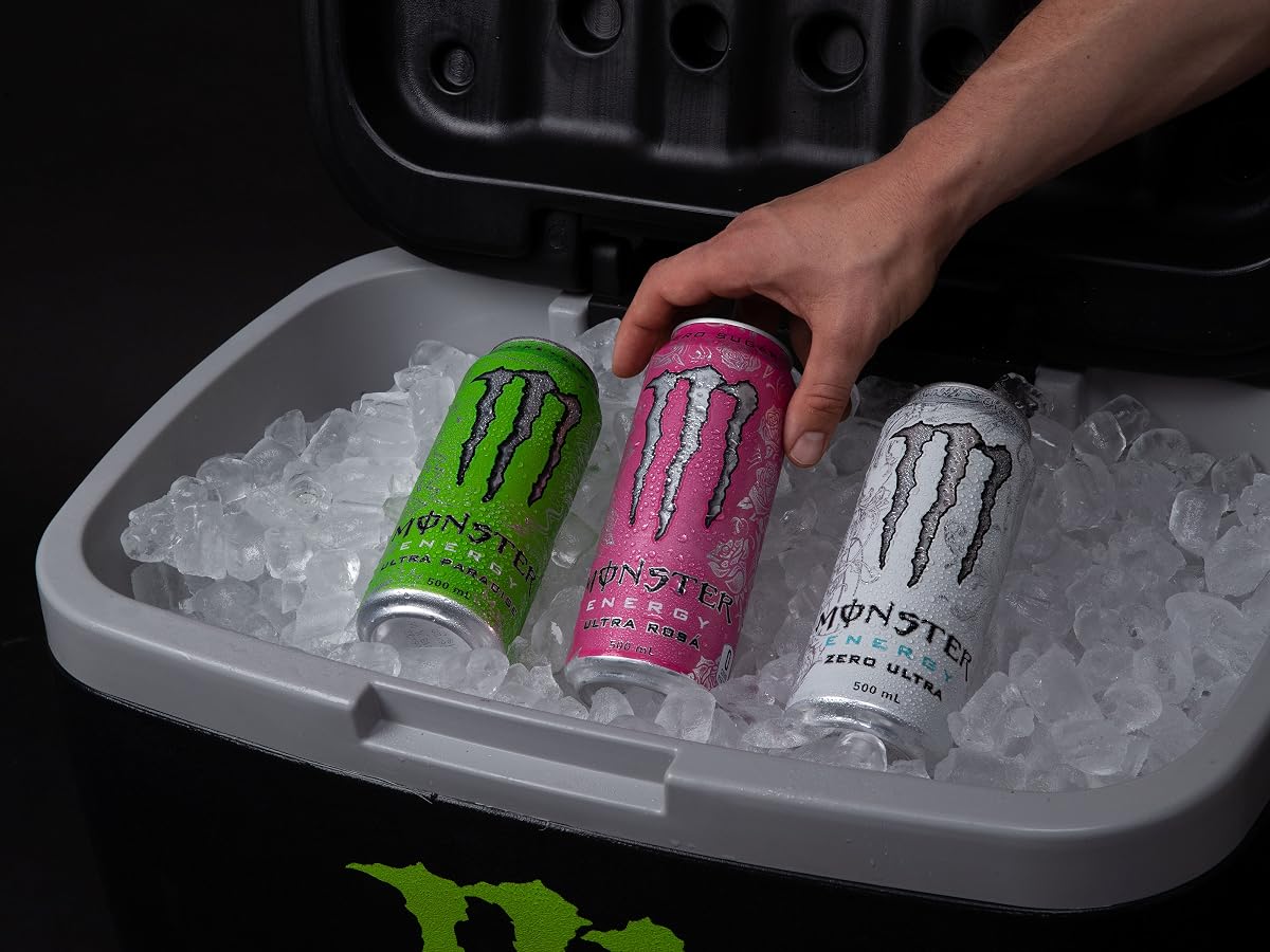 Monster Energy zero sugar cans chilling in a cooler filled with ice