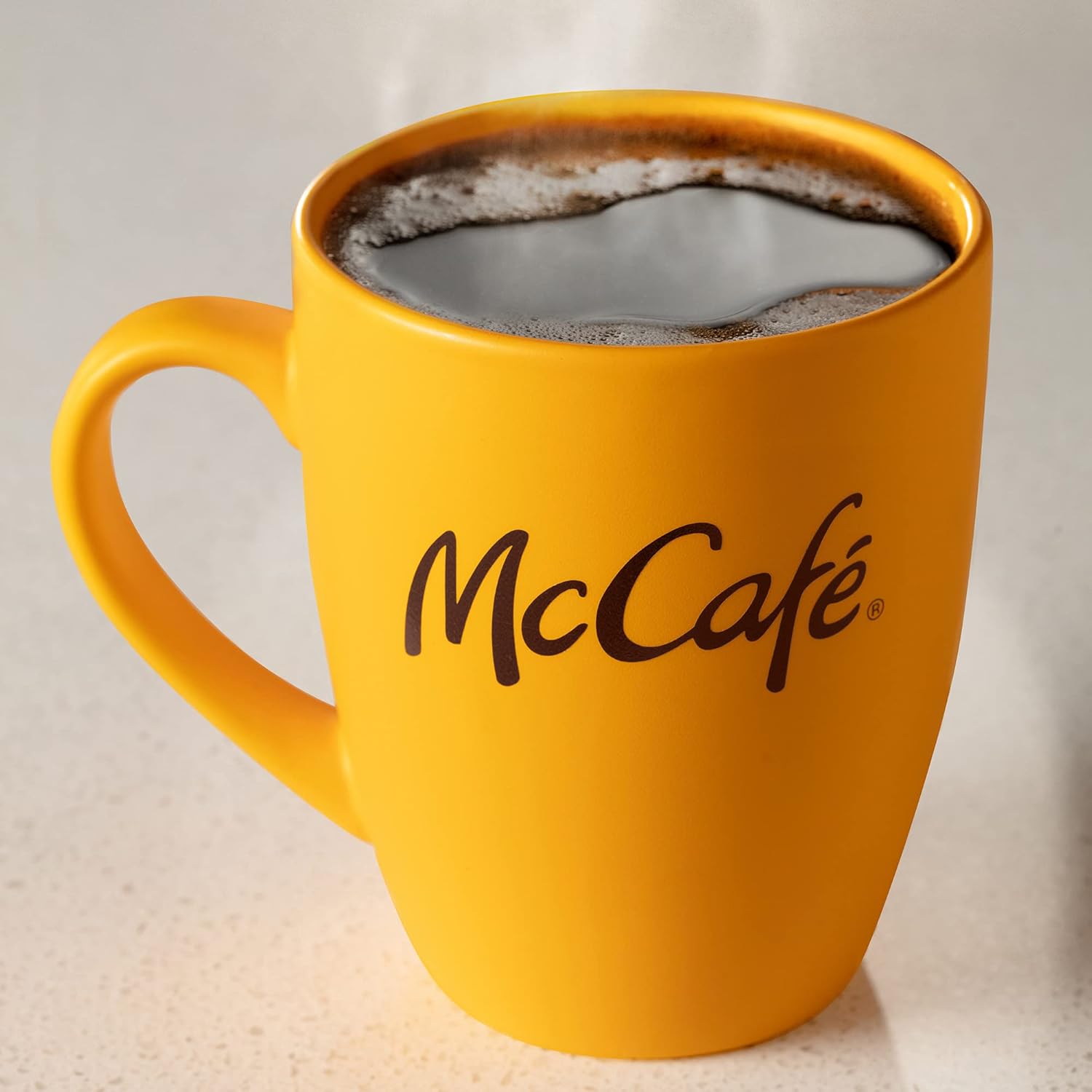 McCafe medium roast coffee served in a yellow mug