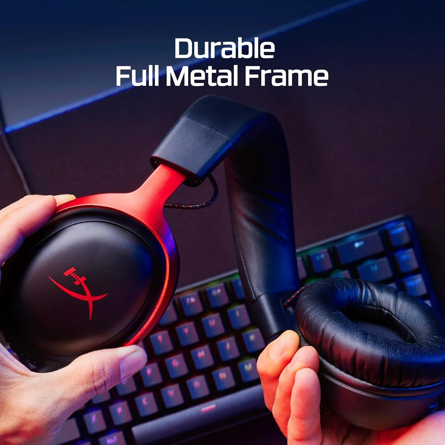 Hands holding a HyperX Cloud III earcup showing its durable full metal frame