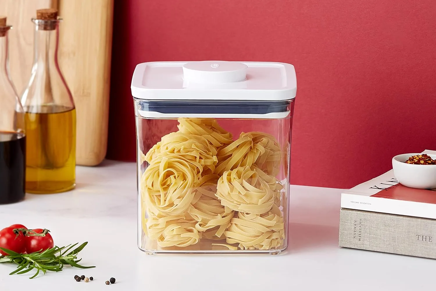 OXO Good Grips POP container with push-button lid filled with dried pasta on a kitchen counter