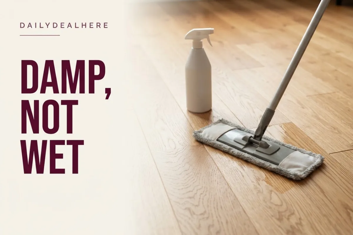 Barely damp flat mop cleaning a hardwood floor along the grain